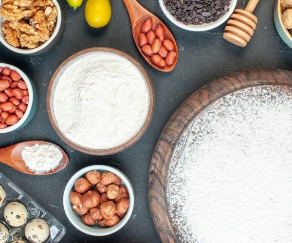 top-view-yummy-fruity-pie-with-flour-nuts-dark-fruit-sweet-pie-sugar-tea-pastry-dessert-biscuit-cake